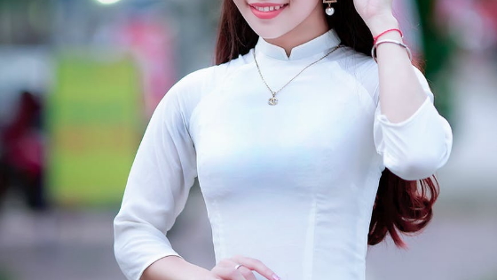 Close up of woman wearing a white dress